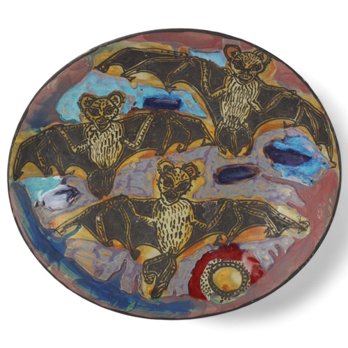 432 - ALEXANDRA COPELAND, A large stoneware studio pottery dish, hand built with painted bat decoration, m... 