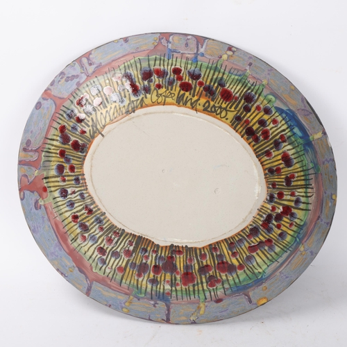 432 - ALEXANDRA COPELAND, A large stoneware studio pottery dish, hand built with painted bat decoration, m... 