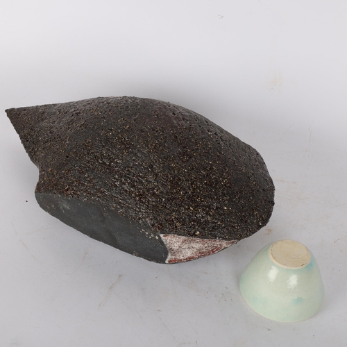 435 - LICY CLAYDON, a black textured stoneware vessel, with red glazed interior and a small celadon glazed... 