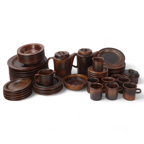 451 - Arabia Finland, a brown stoneware dinner service, 57 pieces