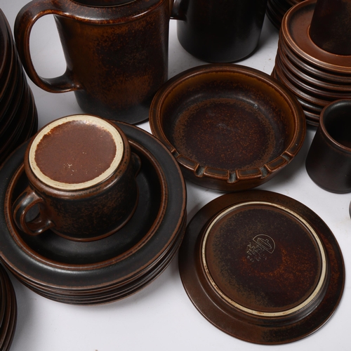 451 - Arabia Finland, a brown stoneware dinner service, 57 pieces