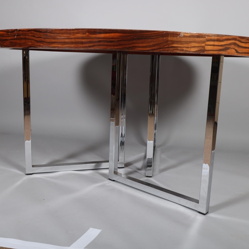 506 - A 1970s' dining table by GORDON RUSSELL, with polished chrome frame, height 73cm, diameter 137cm