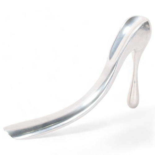 535 - MANOLO BLAHNIK, an aluminium stiletto shoe-horn / sculpture, makers marks to base, length 28cm