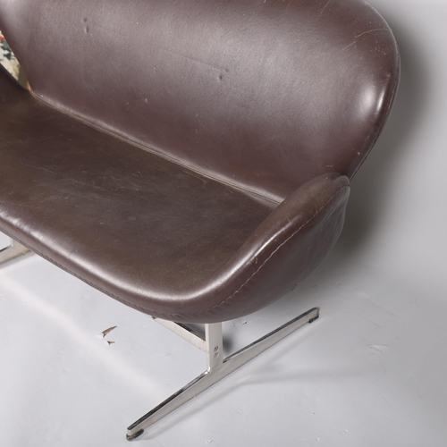 541 - A brown faux leather unholstered Swan sofa, in the manner of ARNE JACOBSEN, with polished aluminium ... 