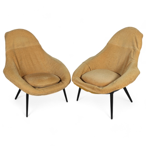 554 - A pair of Lurashell fibreglass lounge chairs, circa 1960s', black fibreglass bodies with ebonised wo... 