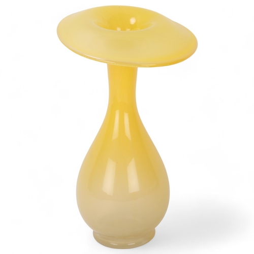 556 - INGEBORG LUNDIN for Orrefors, a glass vase with a drooping rim in yellow, designed 1947, signed Du 3... 