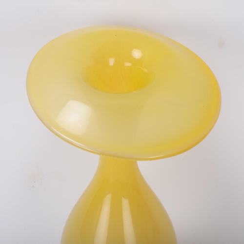 556 - INGEBORG LUNDIN for Orrefors, a glass vase with a drooping rim in yellow, designed 1947, signed Du 3... 