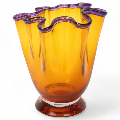 568 - An amber studio glass handkerchief vase, with amethyst glass rim, indistincly signed to base Mika Tu... 