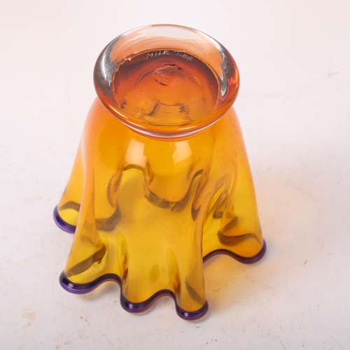 568 - An amber studio glass handkerchief vase, with amethyst glass rim, indistincly signed to base Mika Tu... 