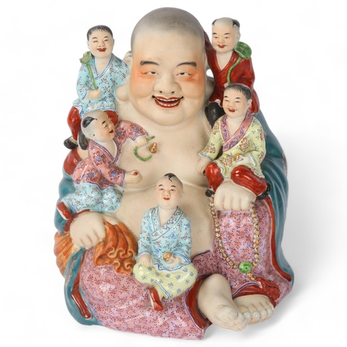 295 - A Chinese porcelain Buddha and children, height 30cm