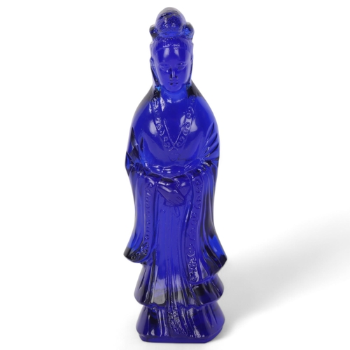 298 - A Chinese moulded blue glass standing figure, height 26cm