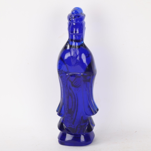 298 - A Chinese moulded blue glass standing figure, height 26cm