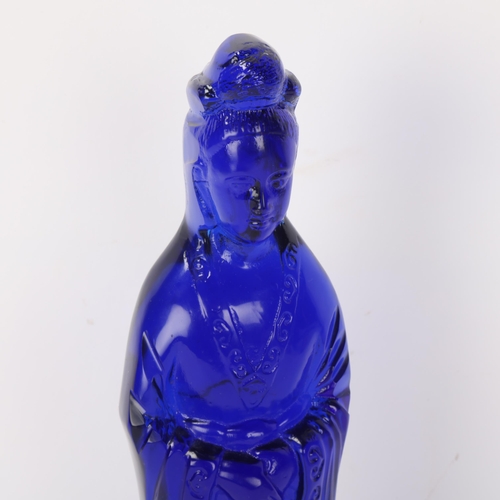 298 - A Chinese moulded blue glass standing figure, height 26cm