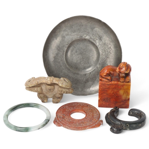 300 - A group of Chinese carved jade and hardstone items, and a Chinese pewter dish (6)