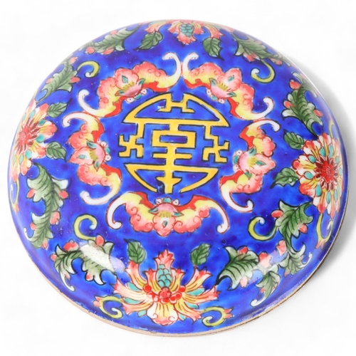 311 - A small Chinese circular enamel box, decorated with bats, diameter 7cm