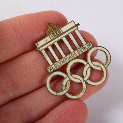 82A - A 1936 Berlin Olympics visitors badge,  base metal with gilt finish and infilled with white enamel m... 