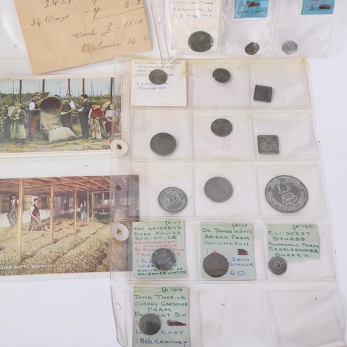 281 - A collection of Sussex hop tokens and postcards, in album