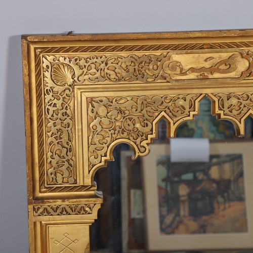 284 - An Islamic giltwood framed wall mirror, dated 1906 on label on reverse, 92cm x 71cm