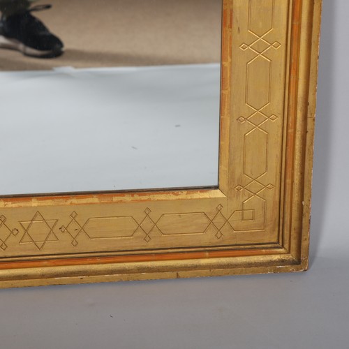 284 - An Islamic giltwood framed wall mirror, dated 1906 on label on reverse, 92cm x 71cm