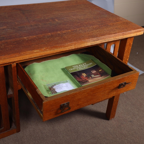 588 - An Arts and Crafts oak desk, attributed to L & J.G.Stickley, New York, with integral book shelves to... 