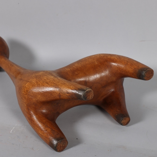 592 - A vintage carved wood modernist cat, unsigned, height 35cm