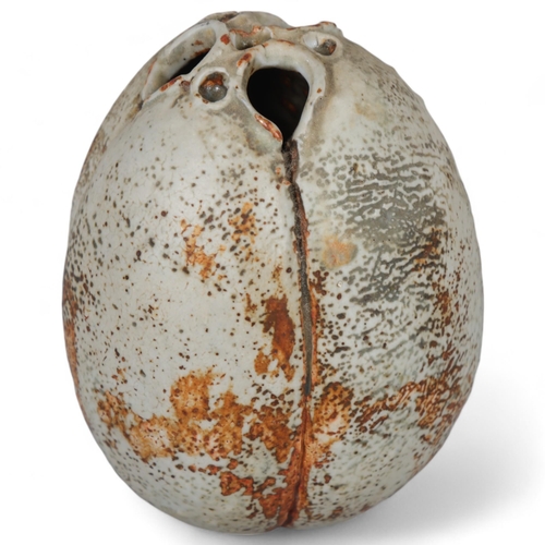 593 - ALAN WALLWORK (1931-2019), a small stoneware seed pod form vessel with iron staining, incised AW mar... 