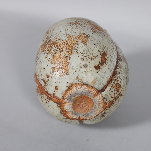 593 - ALAN WALLWORK (1931-2019), a small stoneware seed pod form vessel with iron staining, incised AW mar... 