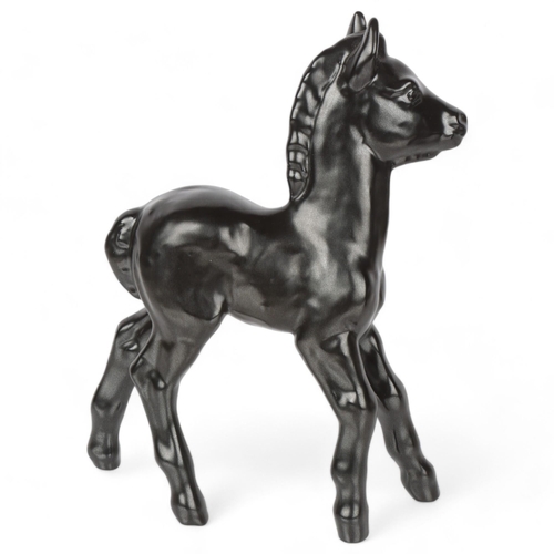 596 - VICKE LINDSTRAND for Upsala Ekeby, a figurine of a black foal, design in 1947, marked on a hoof Upsa... 