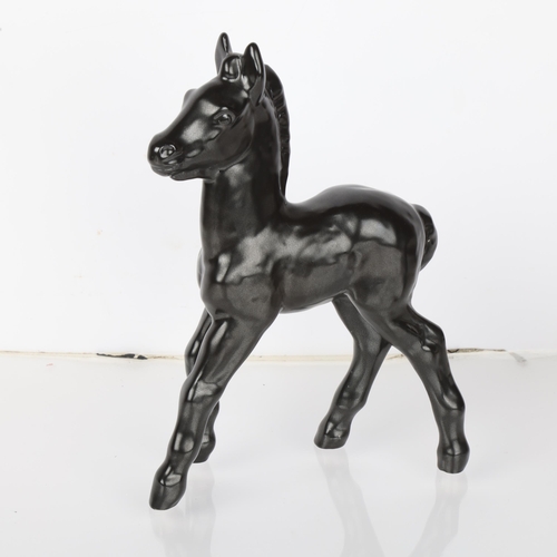 596 - VICKE LINDSTRAND for Upsala Ekeby, a figurine of a black foal, design in 1947, marked on a hoof Upsa... 