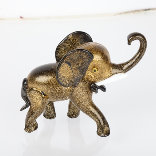 597 - Attributed to ERCOLE BAROVIER for Barovier & Toso Murano, Black pate de verre glass elephant with sl... 