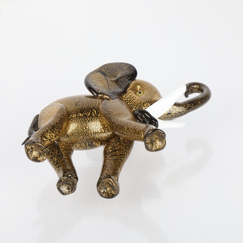 597 - Attributed to ERCOLE BAROVIER for Barovier & Toso Murano, Black pate de verre glass elephant with sl... 