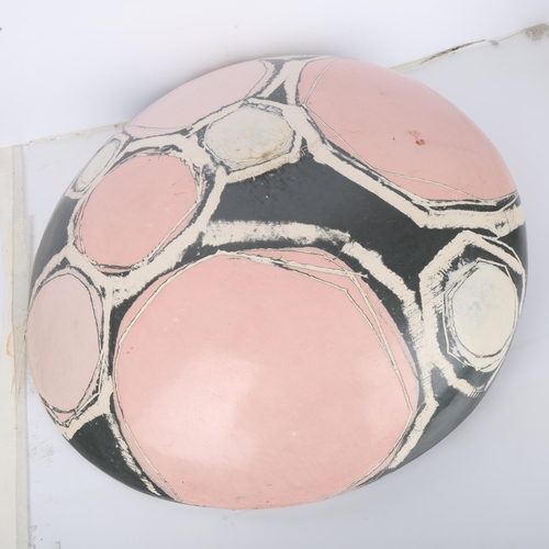 600 - CAROLYN GENDERS (born 1957), a large grey/white/pink earthenware dish burnished terra sigillata slip... 