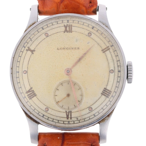 1005 - LONGINES - a Second World War Period stainless steel pilot's type mechanical wristwatch, circa 1944,... 