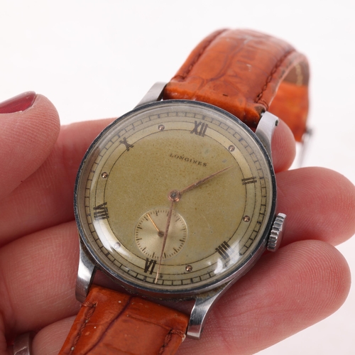 1005 - LONGINES - a Second World War Period stainless steel pilot's type mechanical wristwatch, circa 1944,... 