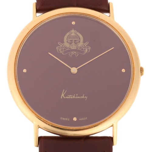 1013 - KUTCHINSKY - an 18ct gold 'Saudi Arabia Emblem' quartz wristwatch, maroon dial with gilt quarterly d... 