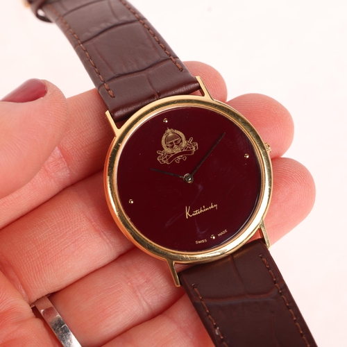 1013 - KUTCHINSKY - an 18ct gold 'Saudi Arabia Emblem' quartz wristwatch, maroon dial with gilt quarterly d... 