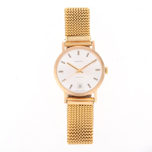 1033 - GARRARD - a Vintage 9ct gold automatic bracelet watch, circa 1970s, silvered dial with applied gilt ... 