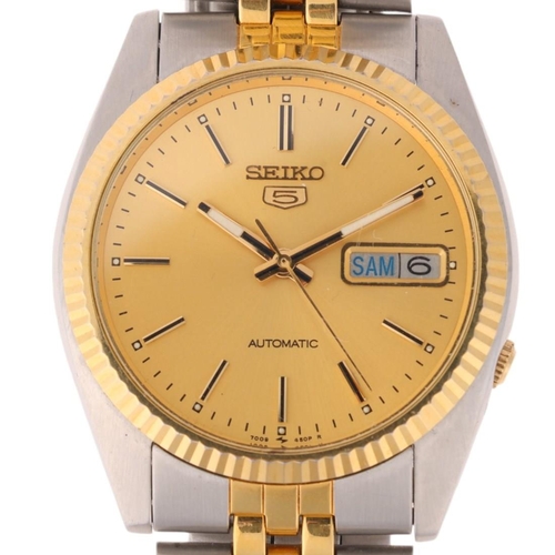 1036 - SEIKO 5 - a gold plated stainless steel automatic day/date bracelet watch, ref. 7009-3110, champagne... 