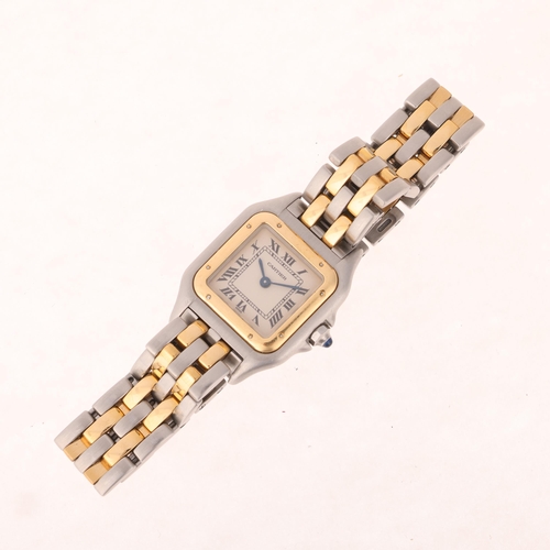 1038 - CARTIER - a lady's bi-metal Panthere quartz bracelet watch, ref. 1120, circa 2001, silvered dial wit... 