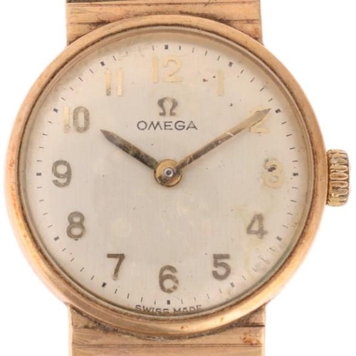 1041 - OMEGA - a lady's Vintage 9ct gold mechanical bracelet watch, ref. 7115513, circa 1968, silvered dial... 