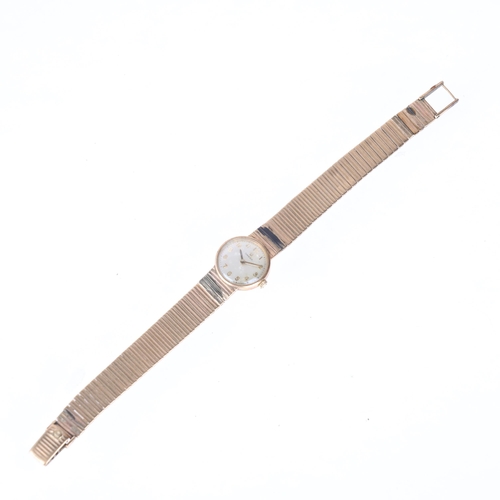 1041 - OMEGA - a lady's Vintage 9ct gold mechanical bracelet watch, ref. 7115513, circa 1968, silvered dial... 