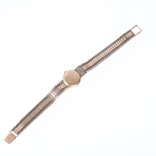 1041 - OMEGA - a lady's Vintage 9ct gold mechanical bracelet watch, ref. 7115513, circa 1968, silvered dial... 