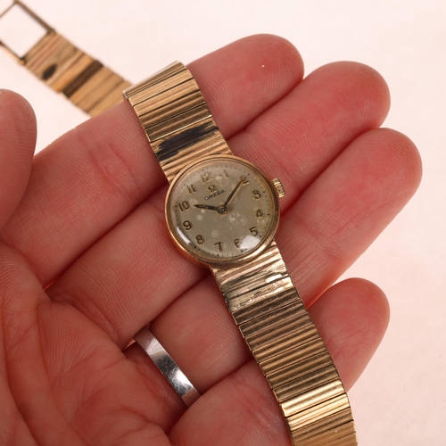 1041 - OMEGA - a lady's Vintage 9ct gold mechanical bracelet watch, ref. 7115513, circa 1968, silvered dial... 