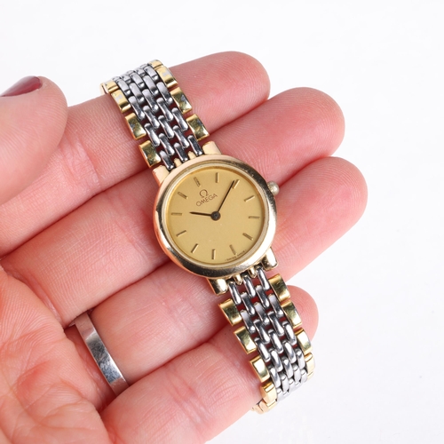 1050 - OMEGA - a lady's gold plated stainless steel De Ville quartz bracelet watch, champagne dial with app... 