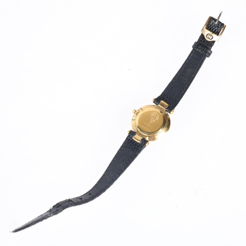 1051 - GUCCI - a lady's gold plated stainless steel 4500L quartz wristwatch, black dial with gilt dauphine ... 