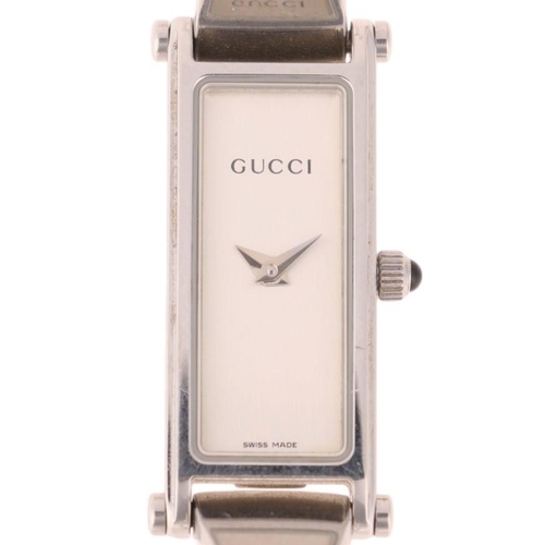 1052 - GUCCI - a lady's stainless steel 1500L quartz bangle watch, circa 2000, silvered dial with dauphine ... 