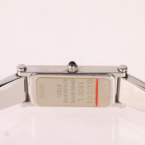 1052 - GUCCI - a lady's stainless steel 1500L quartz bangle watch, circa 2000, silvered dial with dauphine ... 