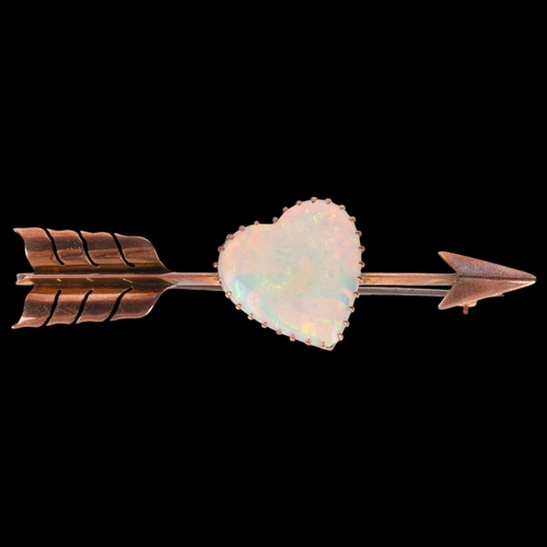 1100 - A large Antique 9ct rose gold opal 'Heart and Arrow' brooch, maker G&SA, set with heart cabochon whi... 