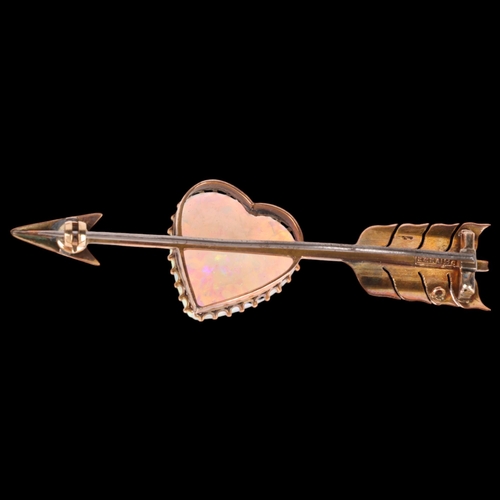 1100 - A large Antique 9ct rose gold opal 'Heart and Arrow' brooch, maker G&SA, set with heart cabochon whi... 