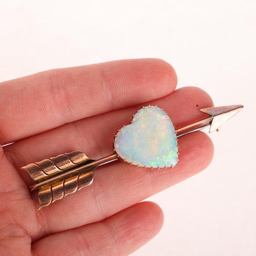 1100 - A large Antique 9ct rose gold opal 'Heart and Arrow' brooch, maker G&SA, set with heart cabochon whi... 